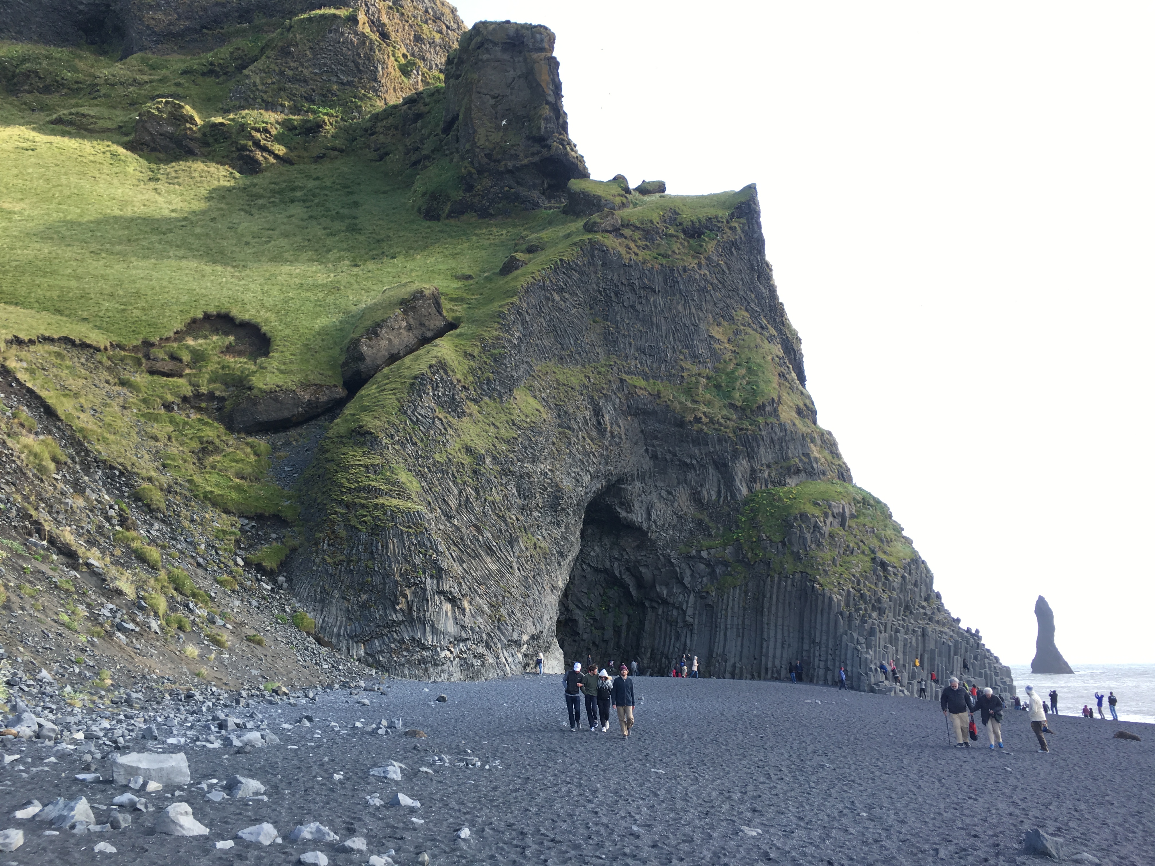 Black sand beach with rock formations